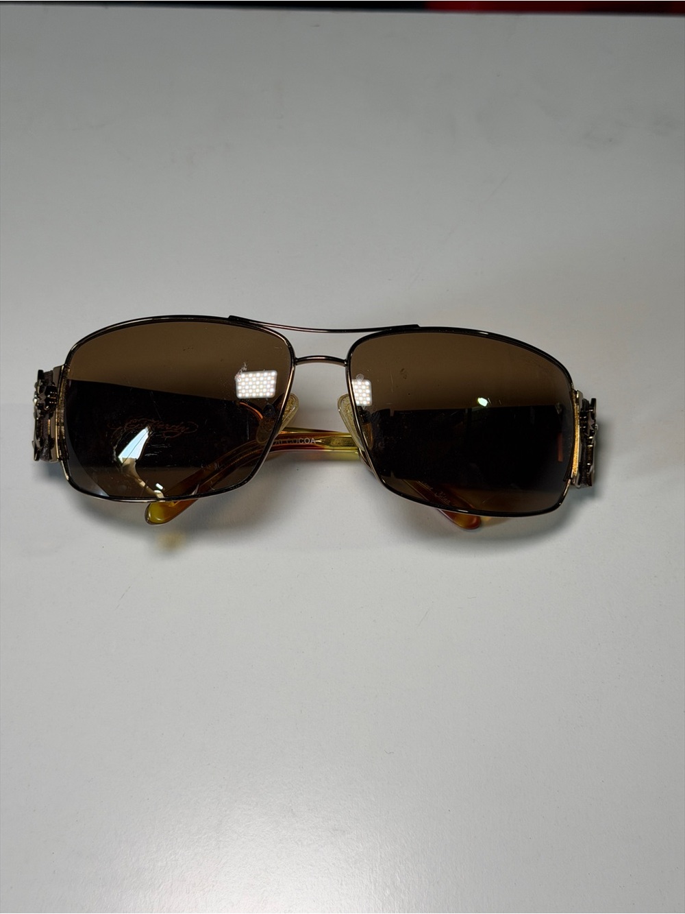 Ed Hardy Menās Brown Lens Sunglasses with Decorative Temples. Minor scratches.